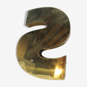 Inverted brass s sign letter