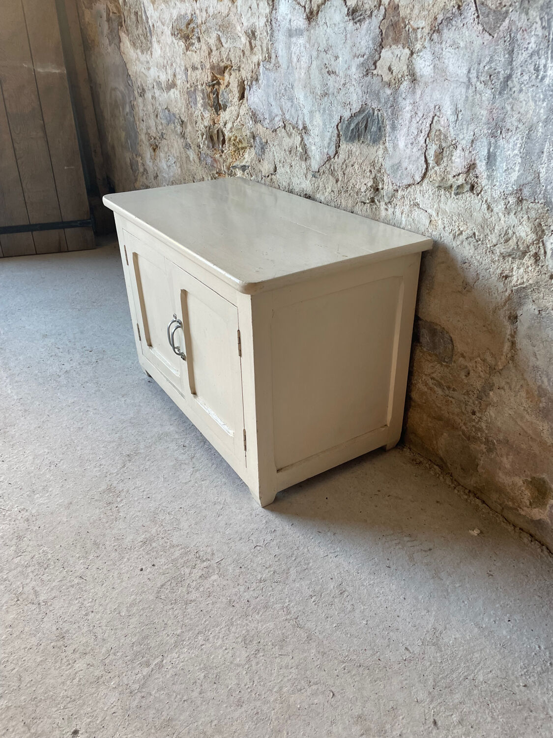 Antique white patinated low cabinet