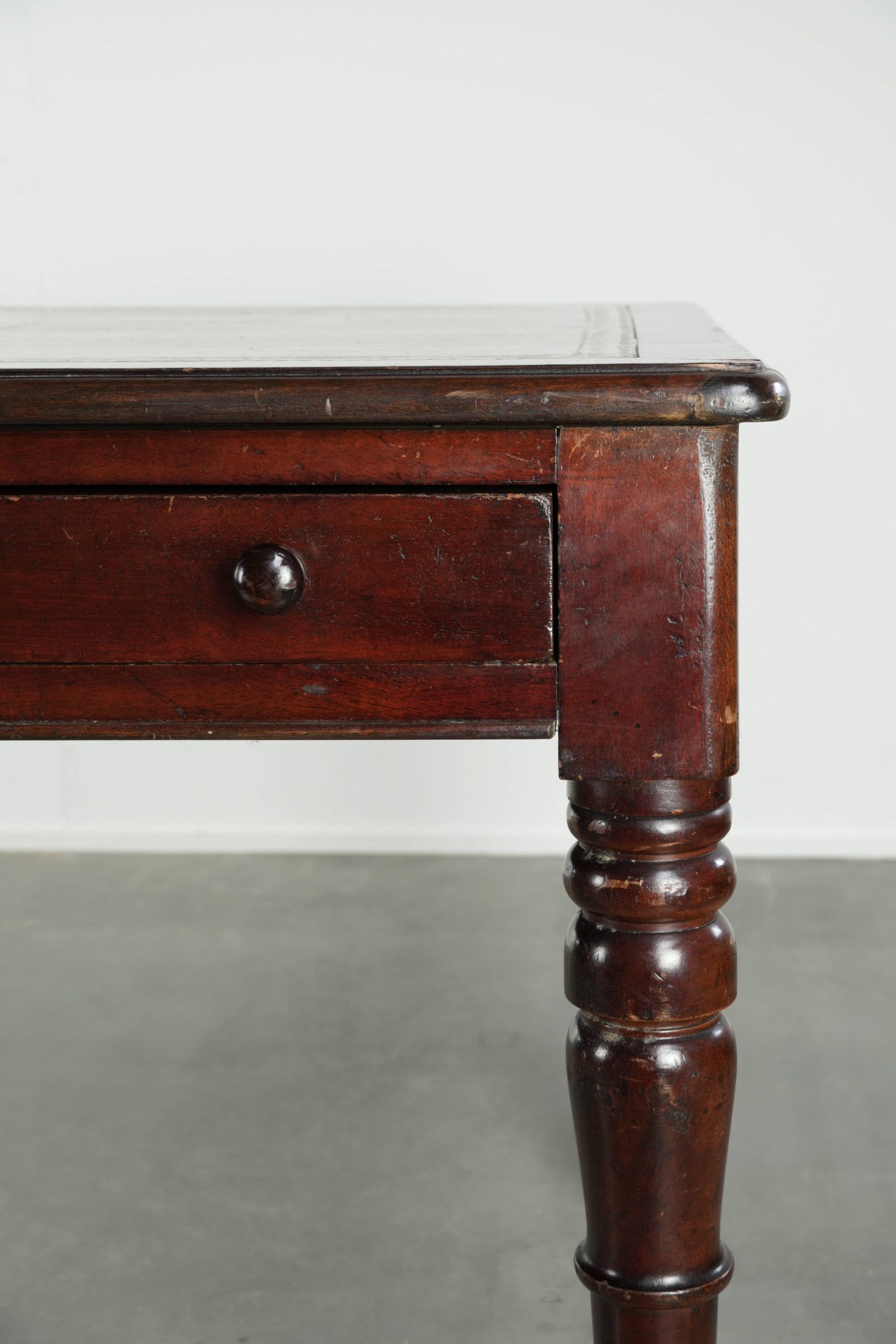 Antique English writing desk from the late 19th century with a warm colour