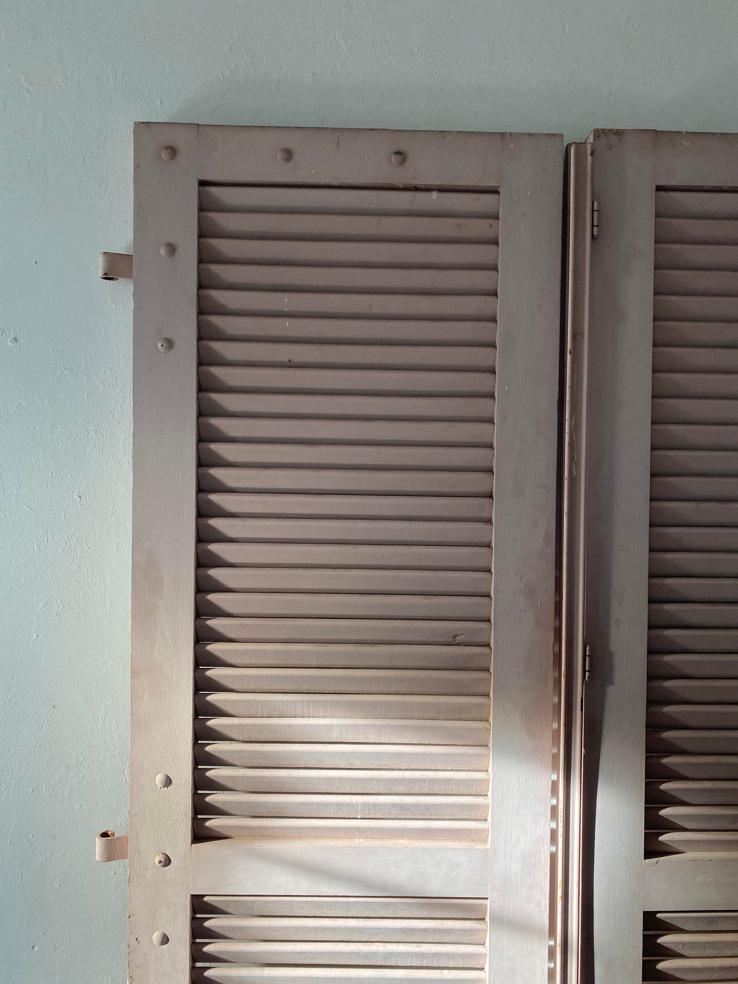 Pair of shutters with wooden shutters in old pink color