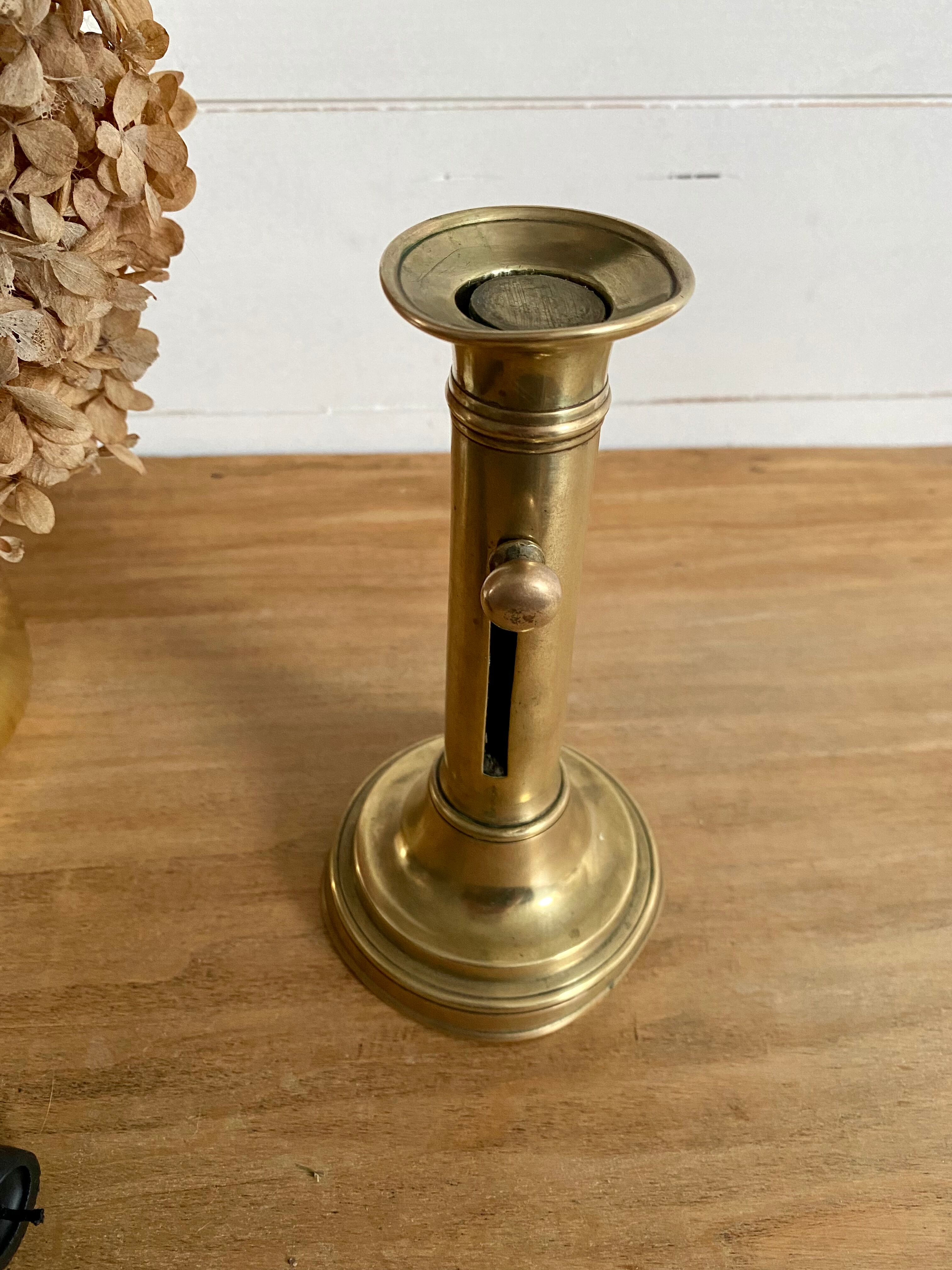 Nineteenth-century brass pull-out candle holder