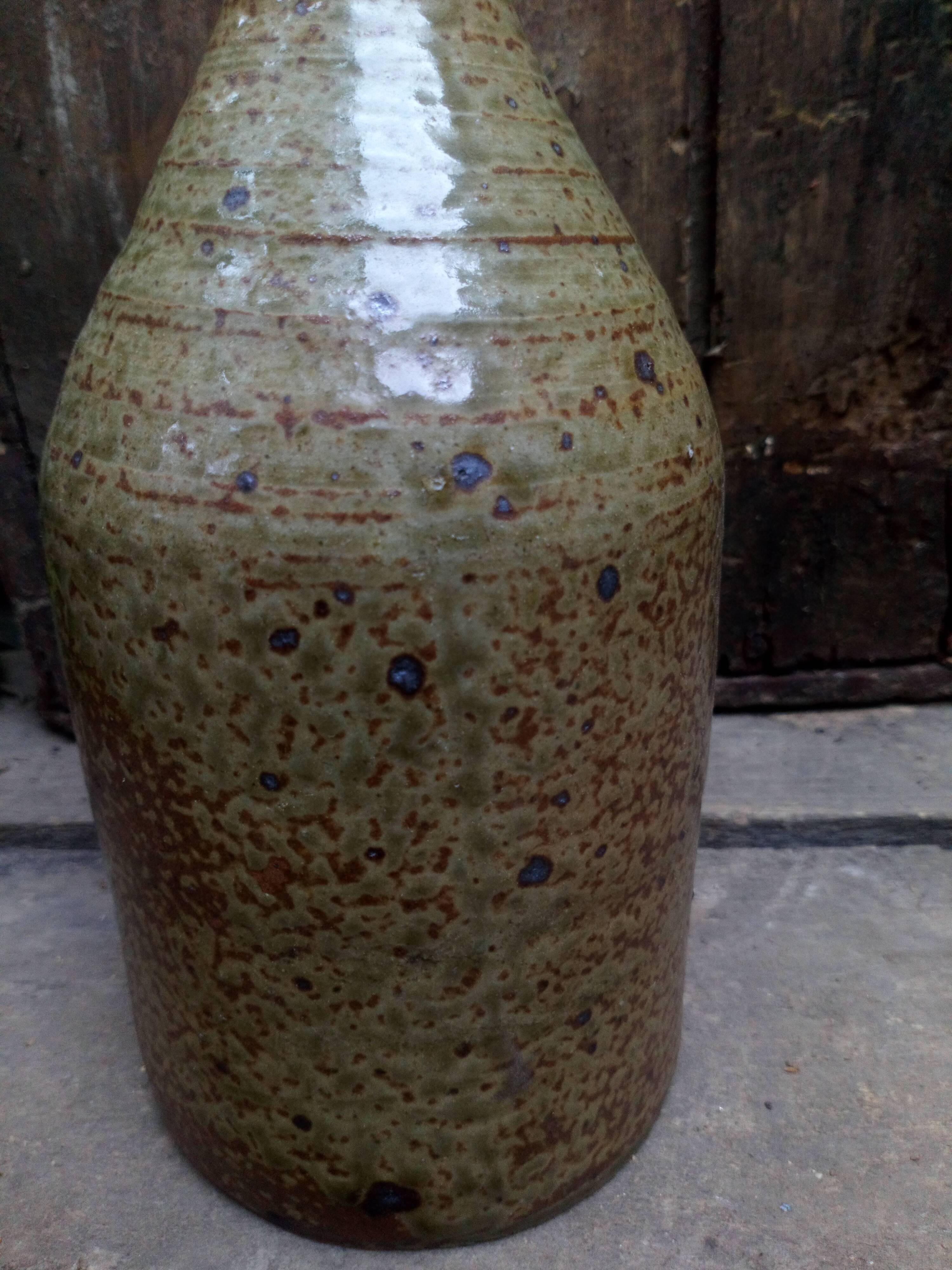Bottled sandstone vase with a narrow neck