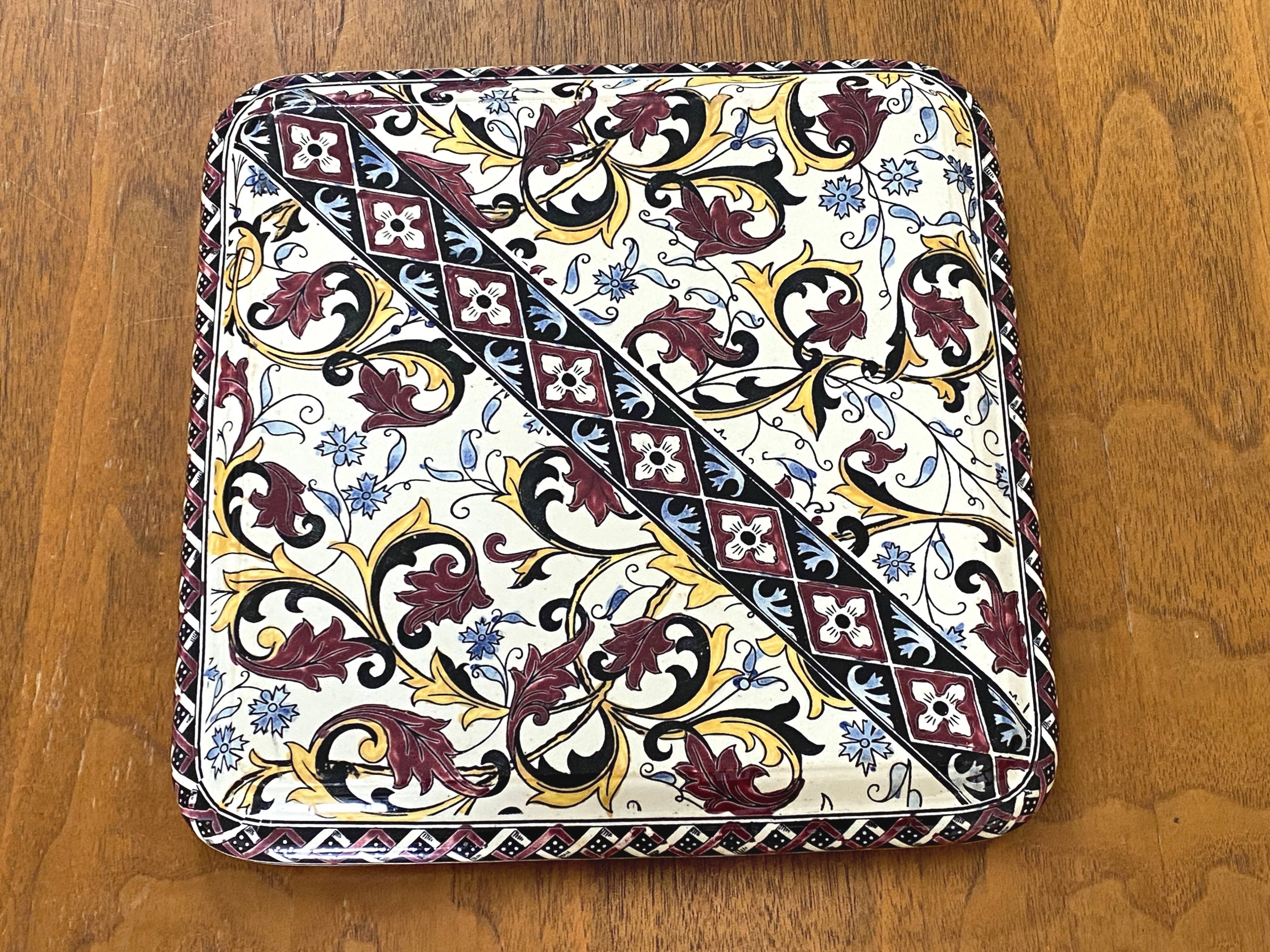 Vintage trivet in Gien earthenware with cornflower decoration.