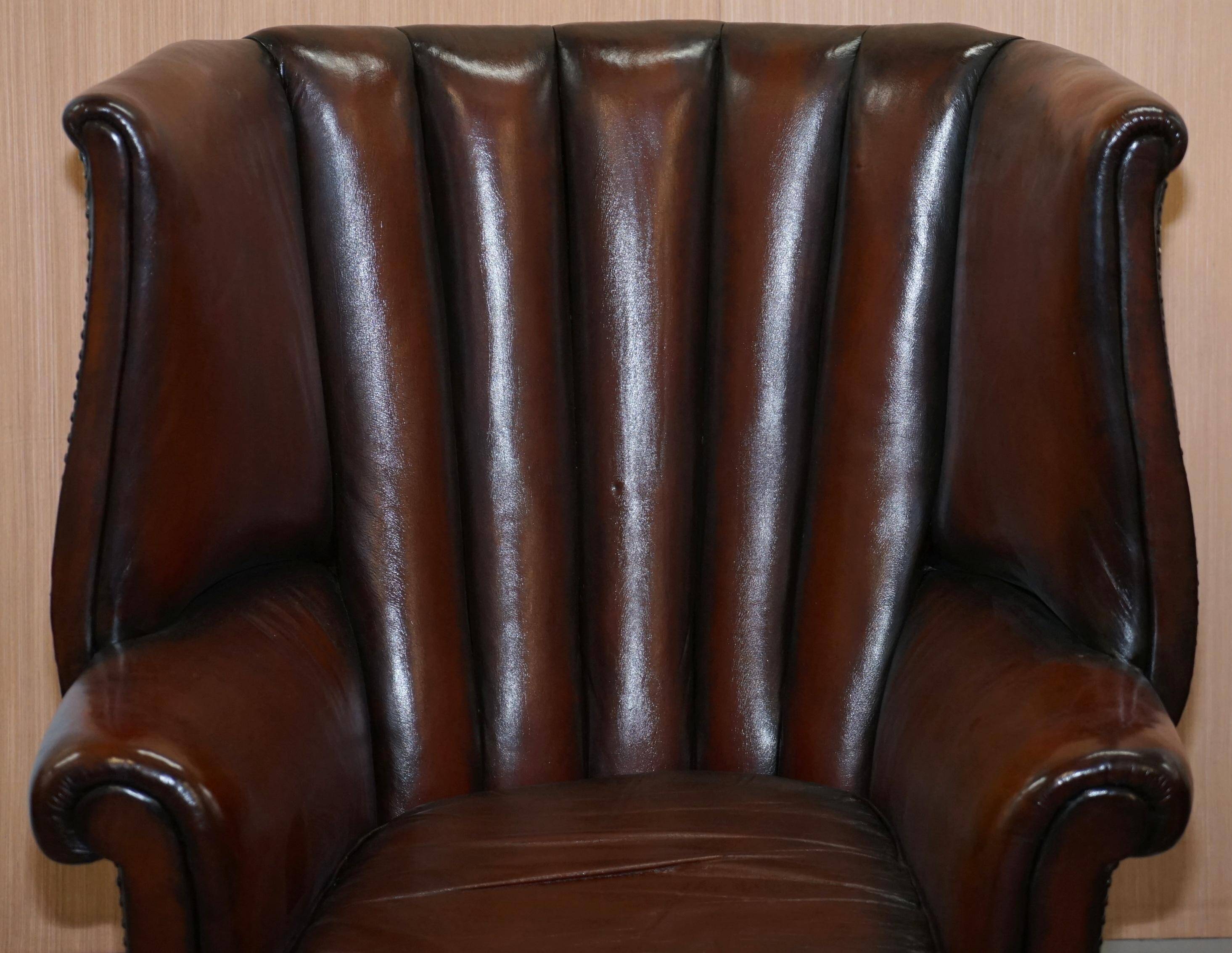 Victorian leather canapé and armchair, barrel back, circa 1860, restored.