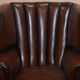 Victorian leather canapé and armchair, barrel back, circa 1860, restored.