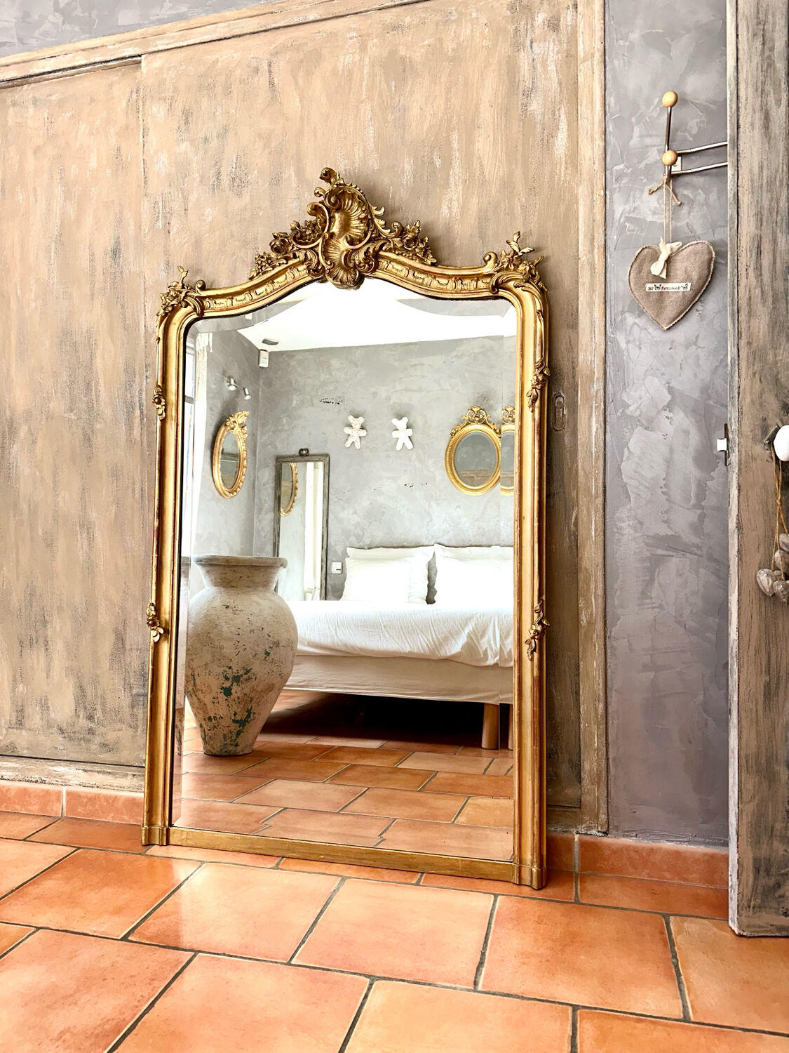 Antique gilded mirror with Louis XV pediment