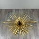 Gold metal and glass coffee table, 20th century, in the style of Robert Goos.