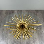 Gold metal and glass coffee table, 20th century, in the style of Robert Goos.