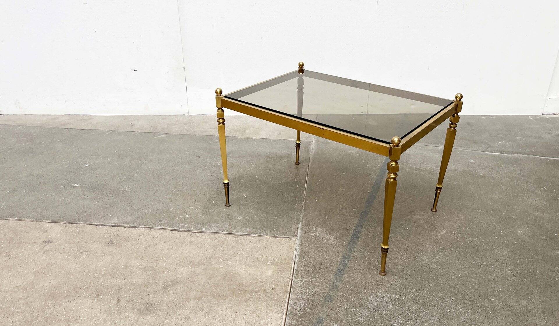 Mid-century German Hollywood neoclassical brass and glass side table from the 1950s.