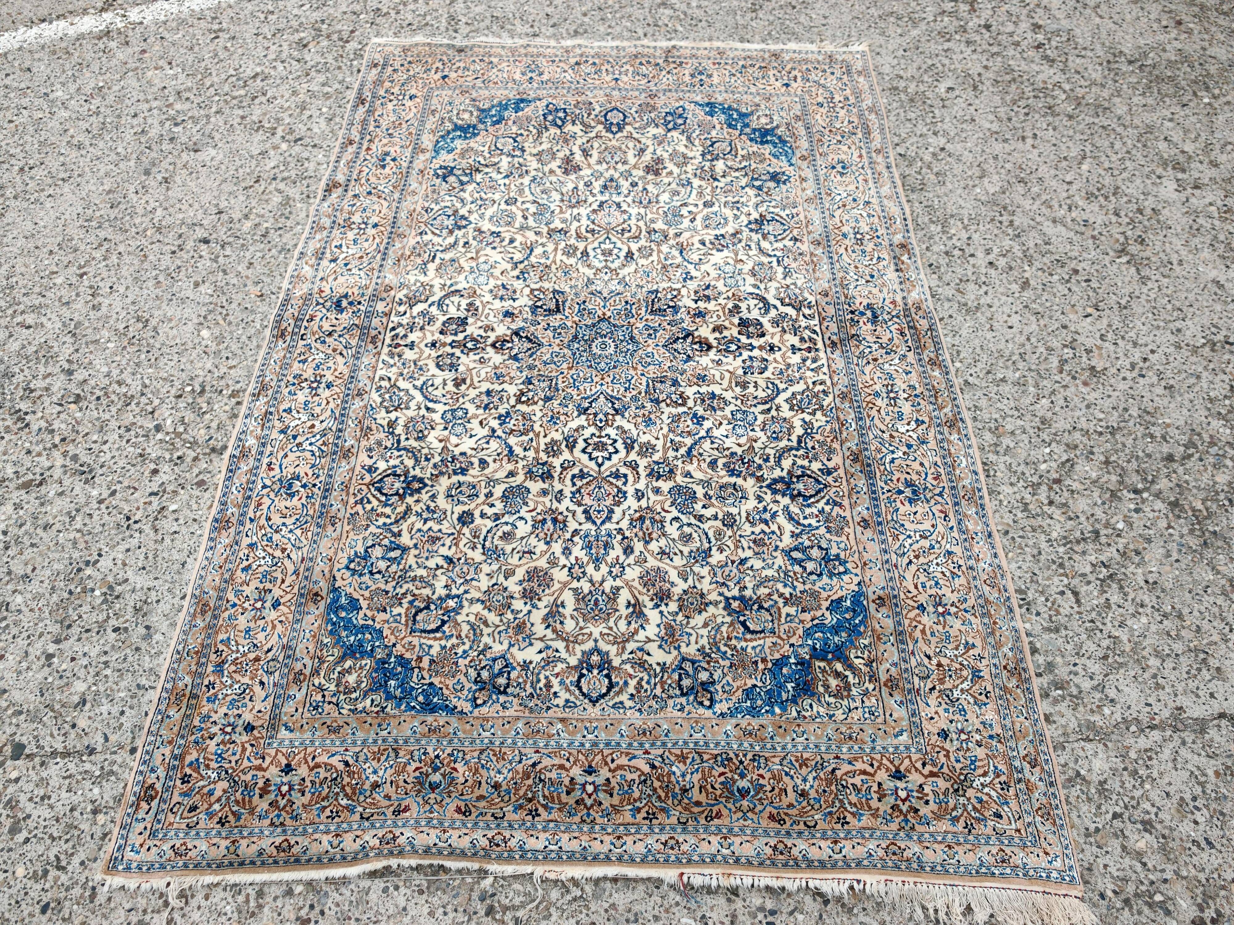 Vintage Persian Nain carpet, handwoven wool and silk from the 1940s.