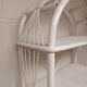 White lacquered rattan bookcase