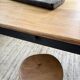 Oak farmhouse table with turned black legs.