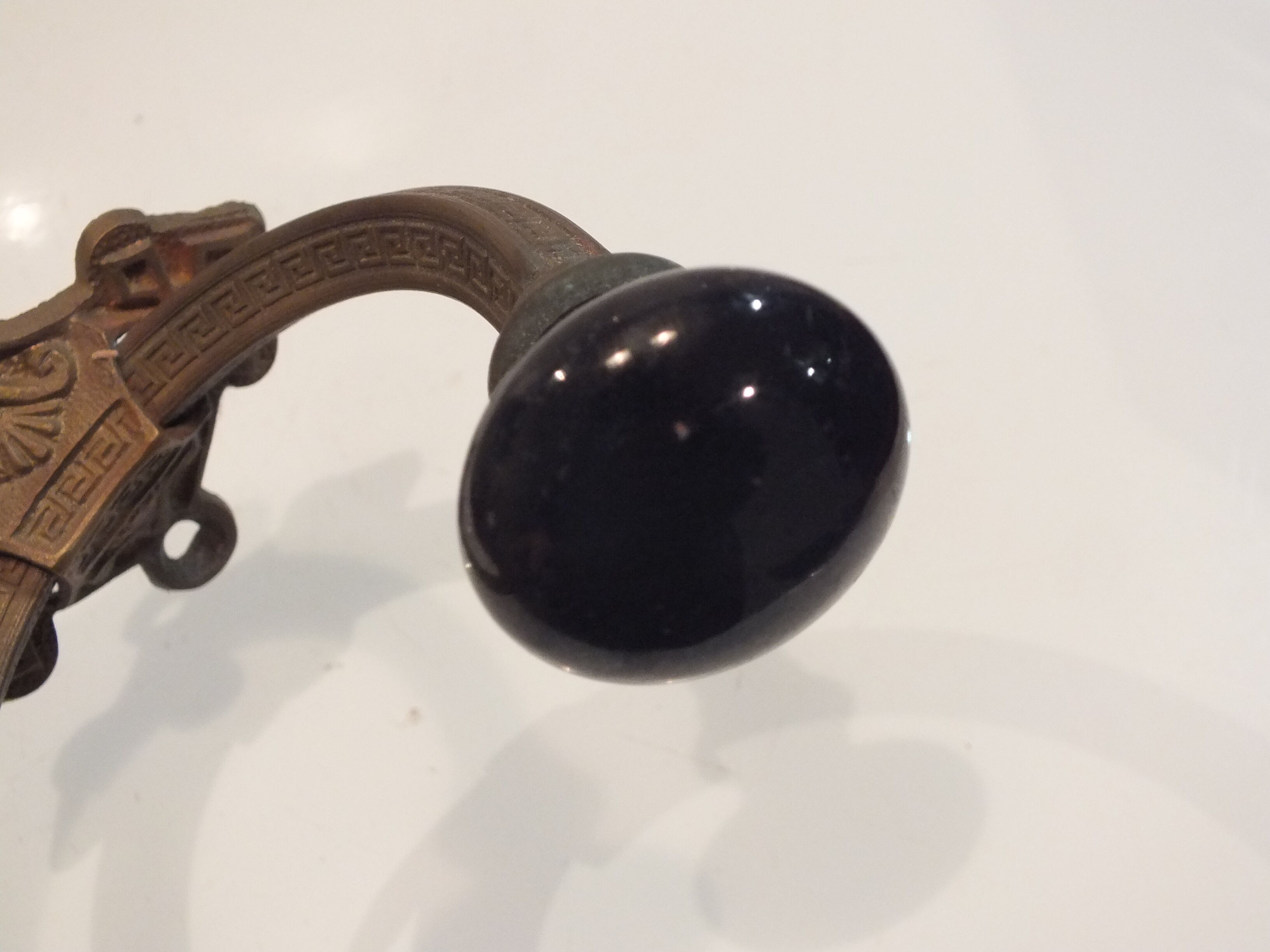 Old large hook Napoleon III in brass and earthenware