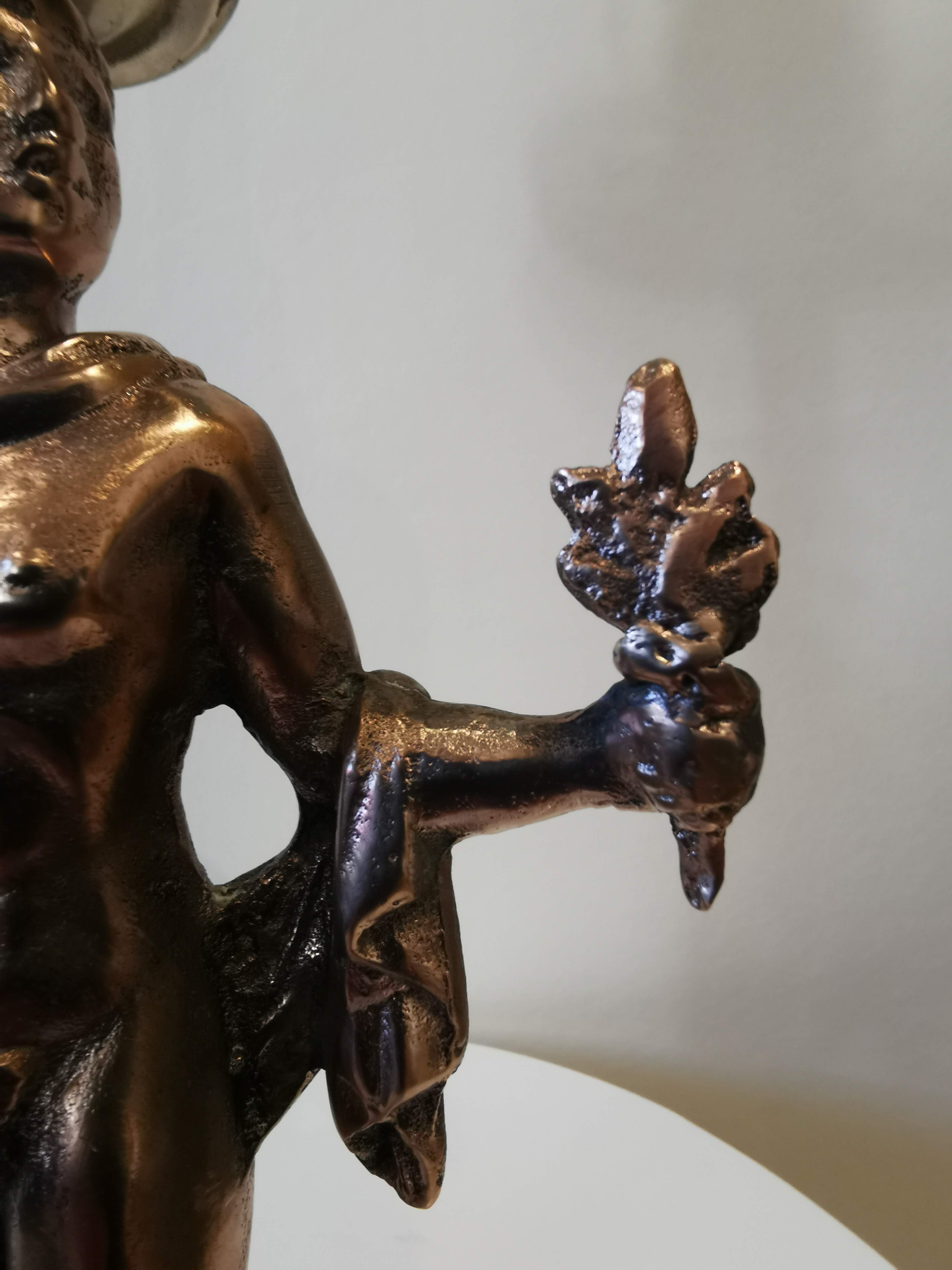 Large kerosene lamp mounted on bronze statue. Late nineteenth century