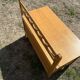Vintage 1960s bank chest in light oak and rattan weaving.