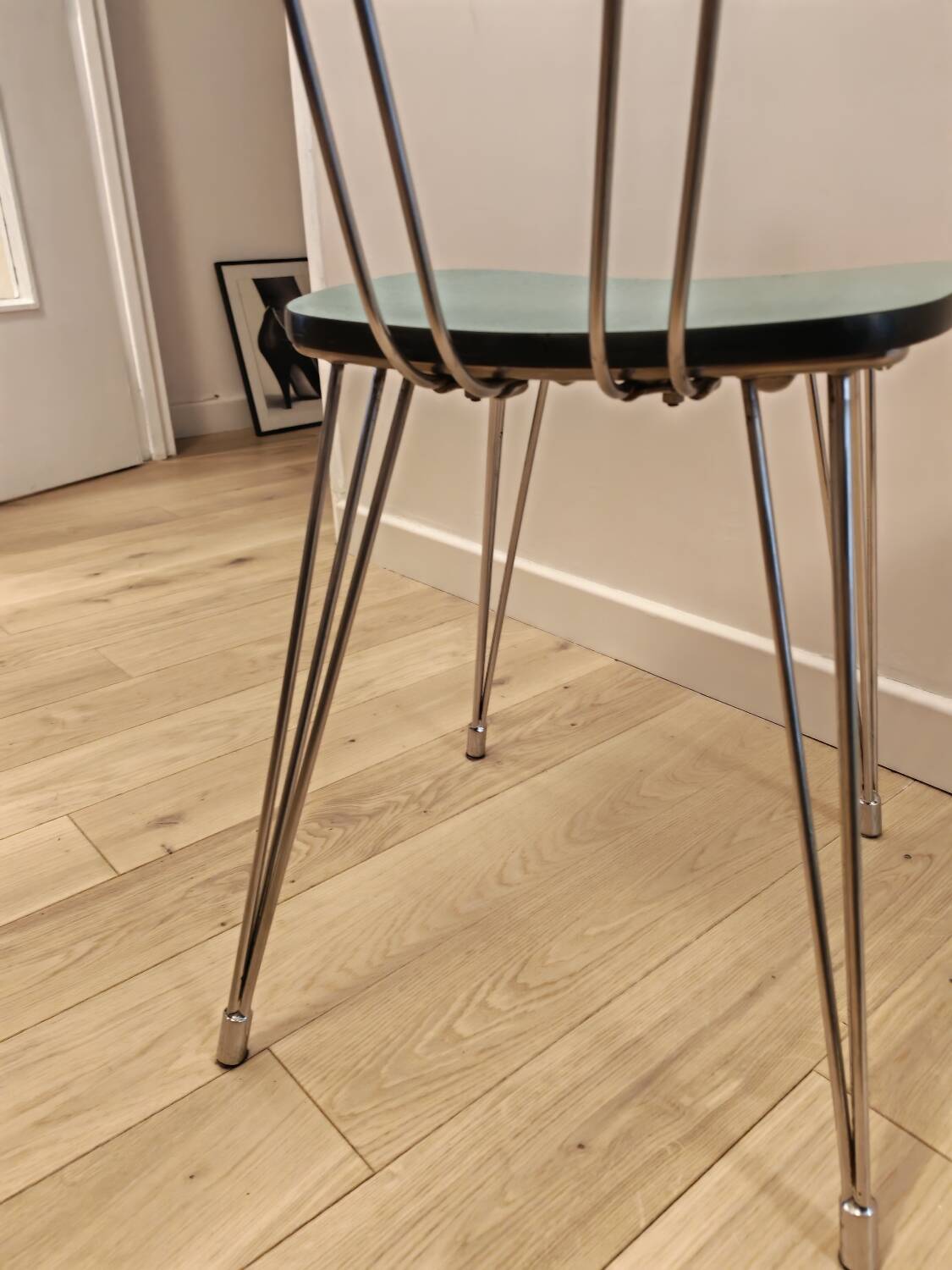 Pair of green Formica chairs with Eiffel legs