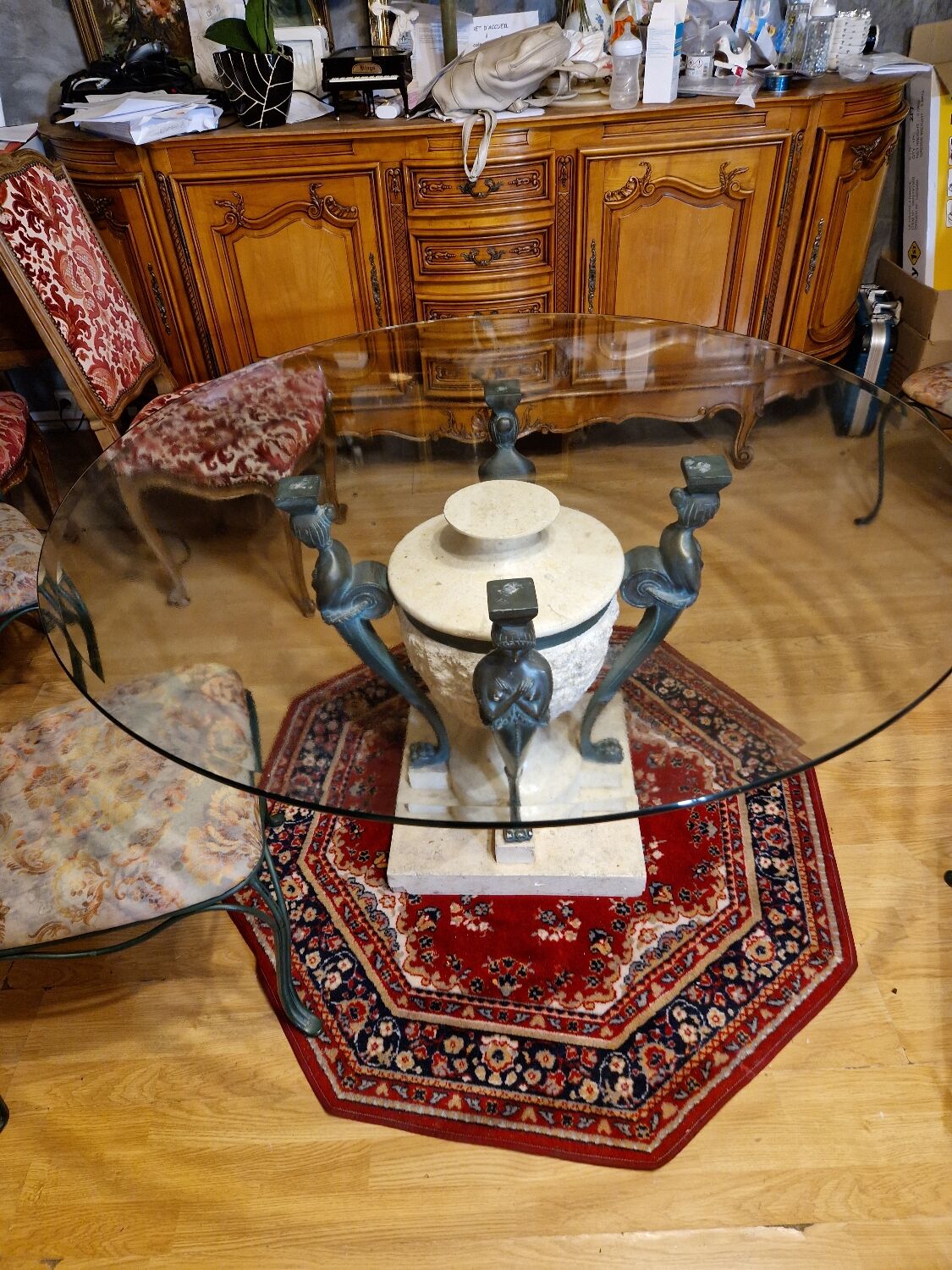 Stone and bronze dining table with ribbed glass top