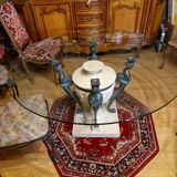 Stone and bronze dining table with ribbed glass top