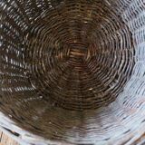 Round wicker basket with a patina