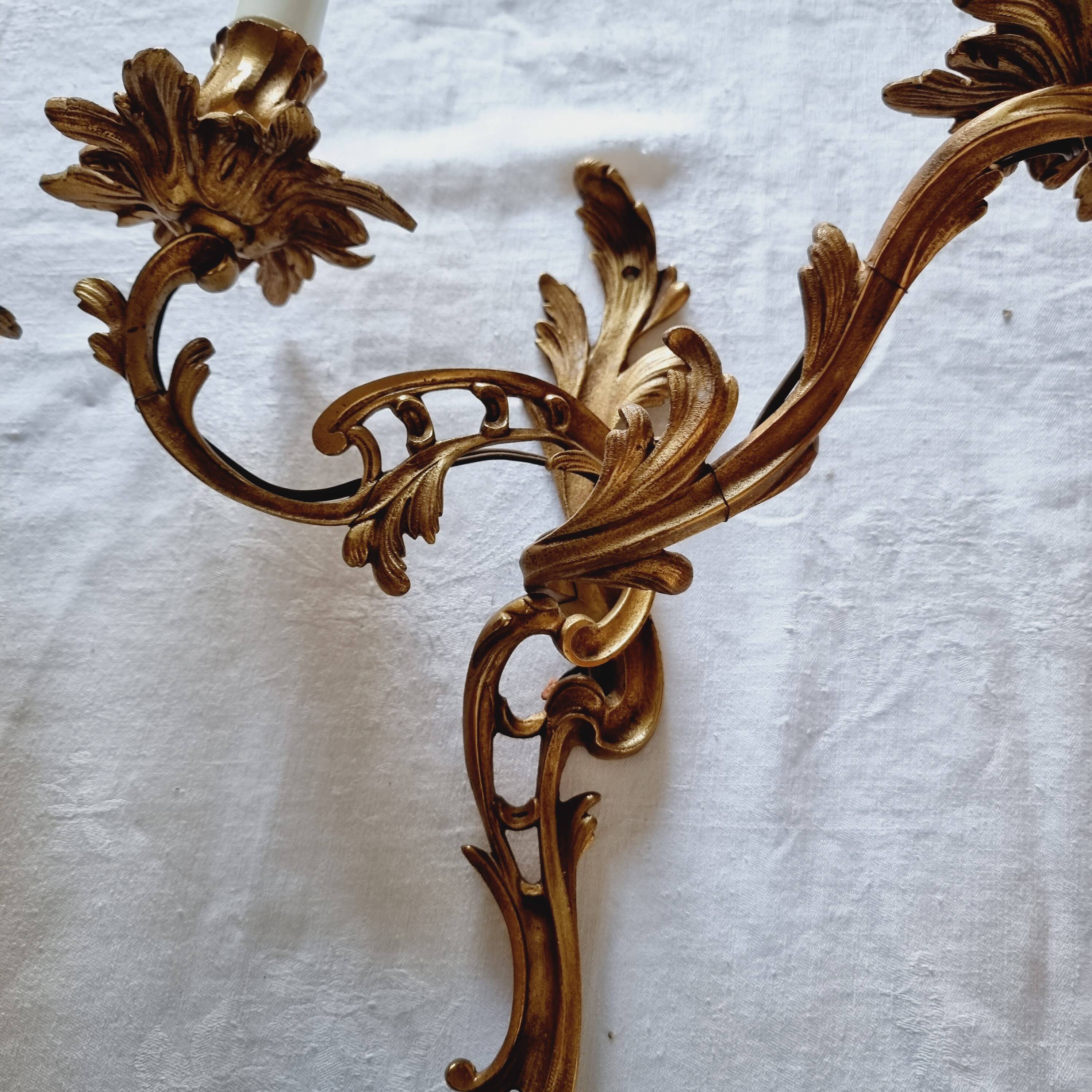 Pair of vintage French wall sconces in bronze, Louis XV Rococo style.