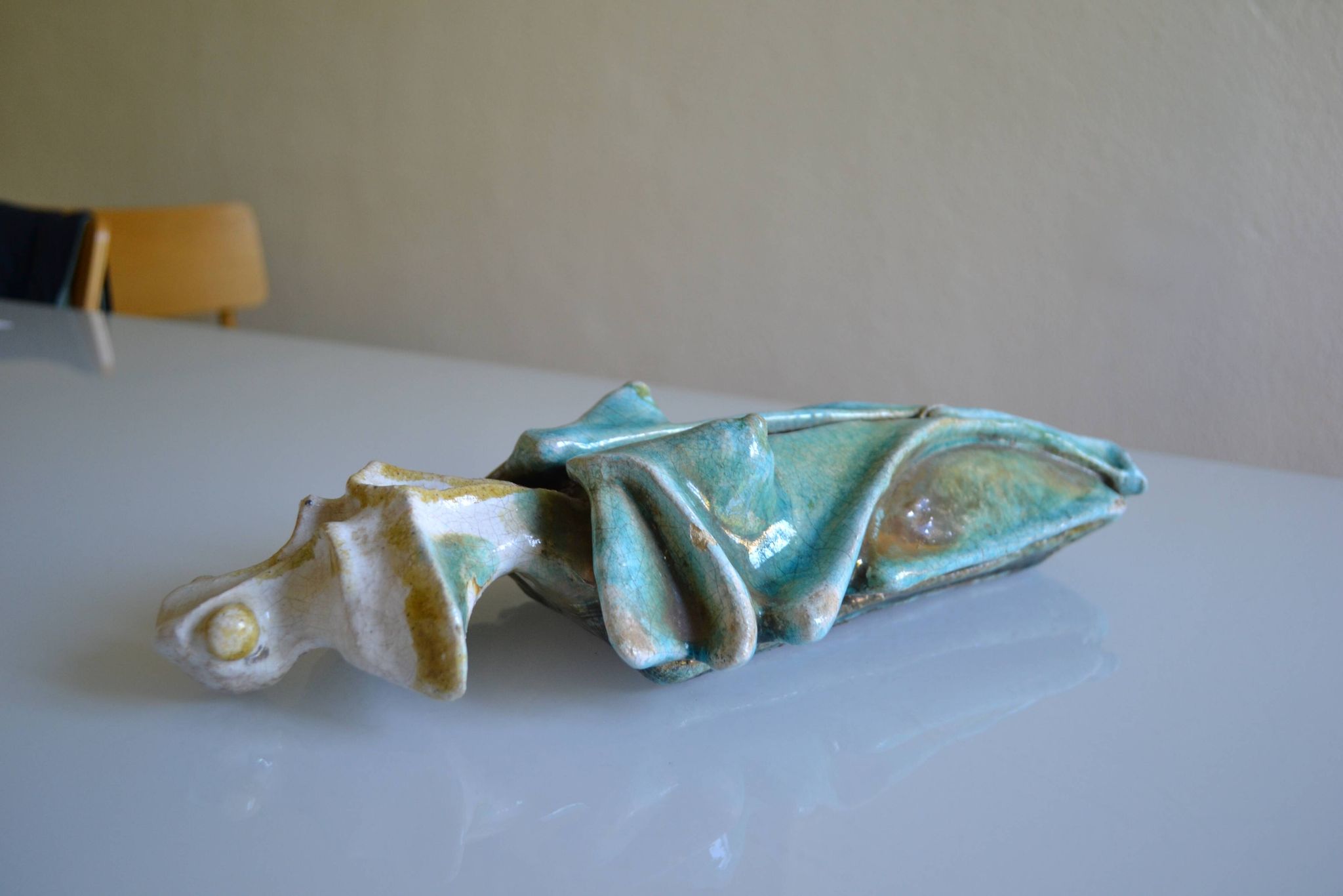 Surreal ceramic sculpture in relief signed to be identified.