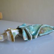 Surreal ceramic sculpture in relief signed to be identified.