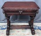 Ancient Flemish Gothic desk. Solid oak with richly carved dolphins.
