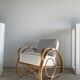 Large rattan rest chair and white cushions