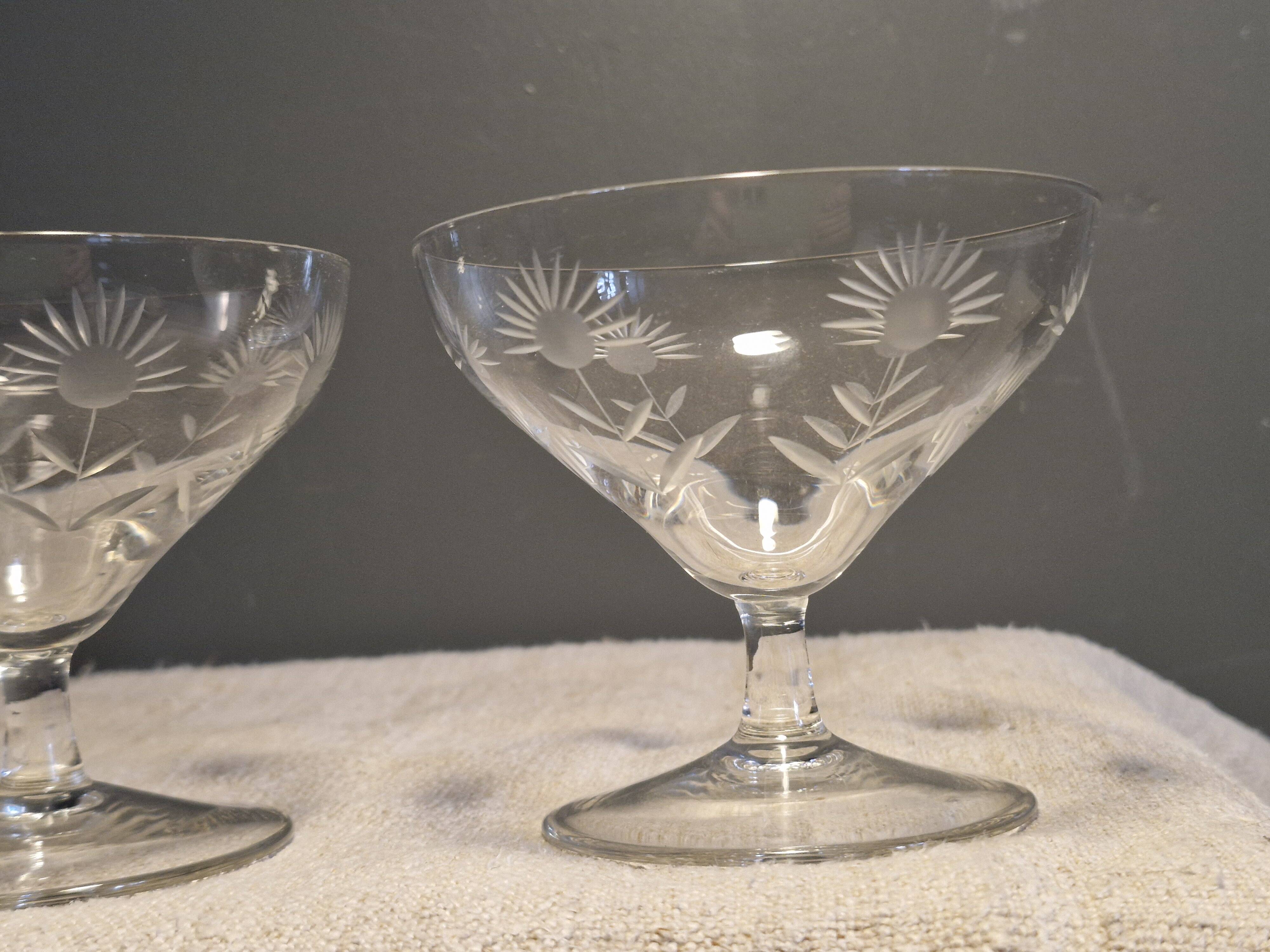 3 antique champagne coupes in engraved crystal with large daisies.