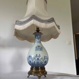 19th-century blue grand feu faience lamp, tripod bronze, fringed lampshade.