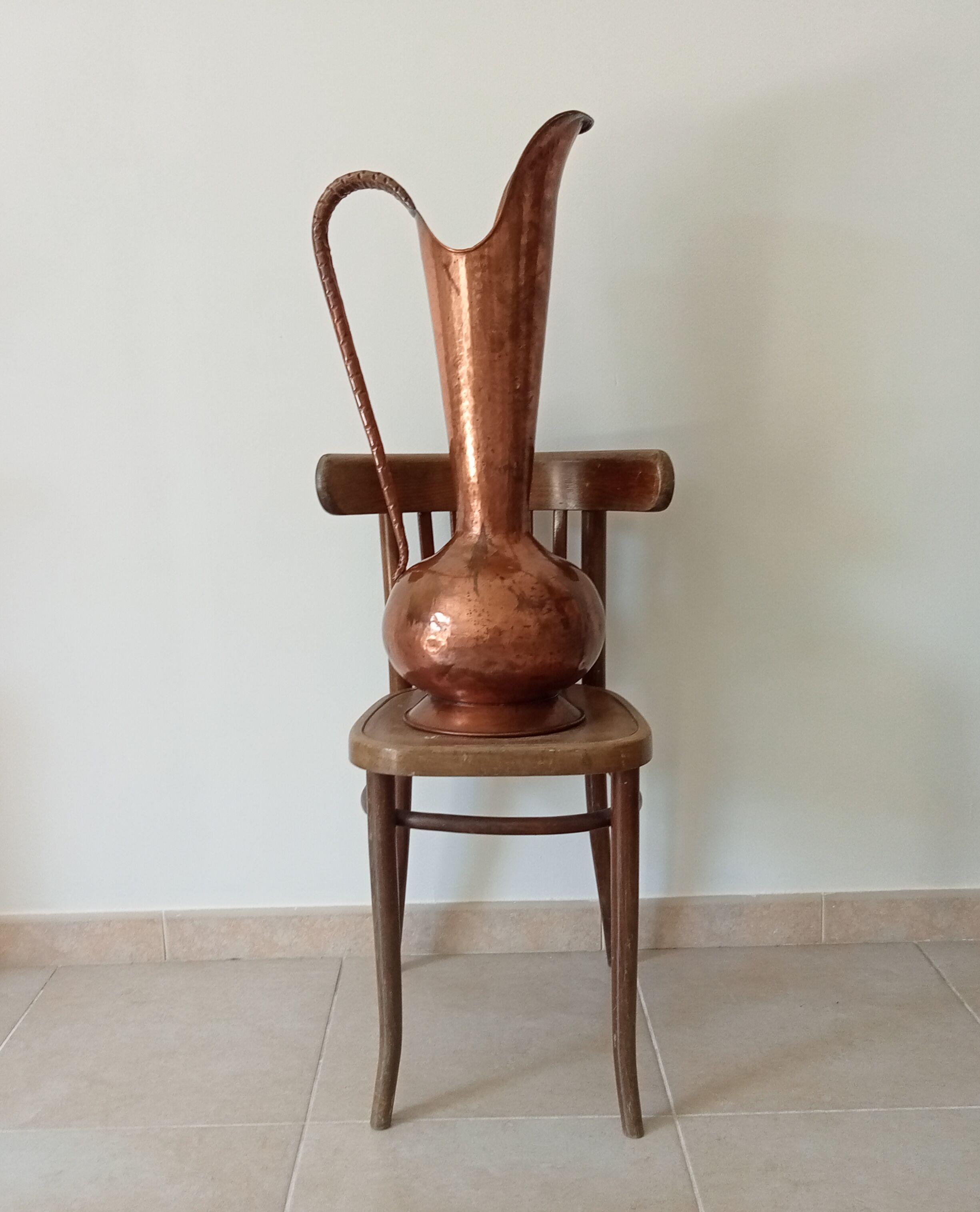 Old italian amphora vase in hammered copper