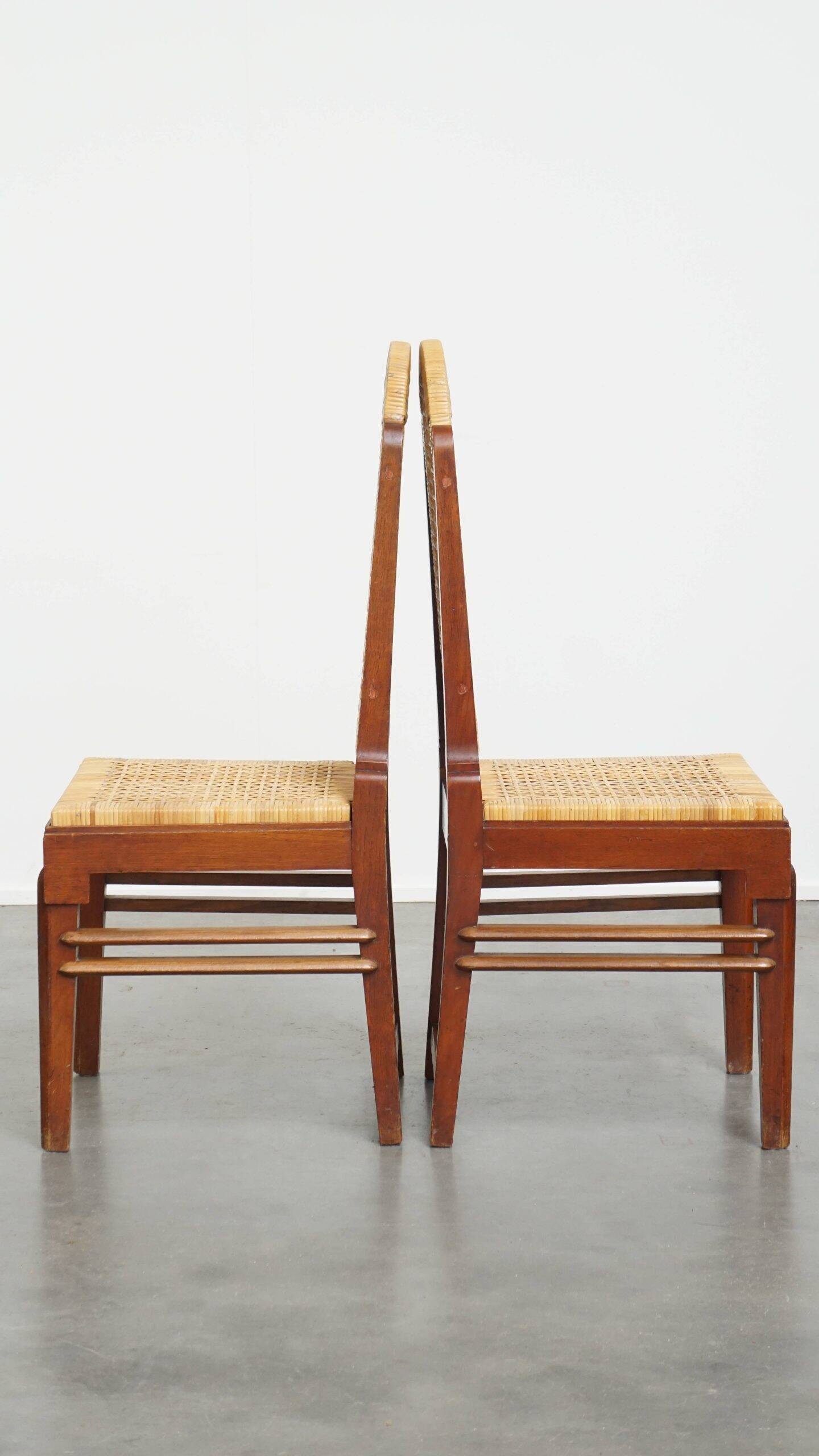 et of 6 wooden Art Deco design dining chairs with a wicker seat and backrest