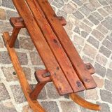 Rustic bench, old folk art, snow sled, Alps.