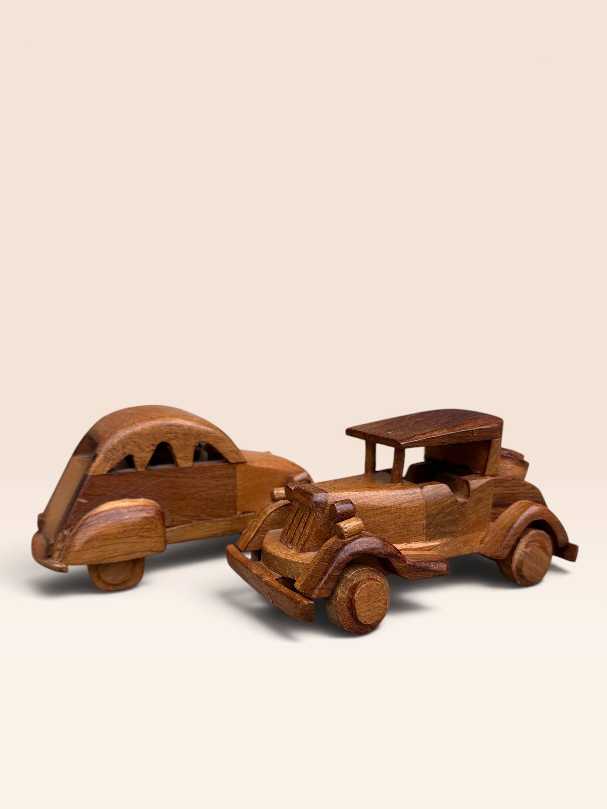 Pair of small handcrafted wooden cars