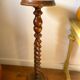 Antique pedestal table with a twisted column.