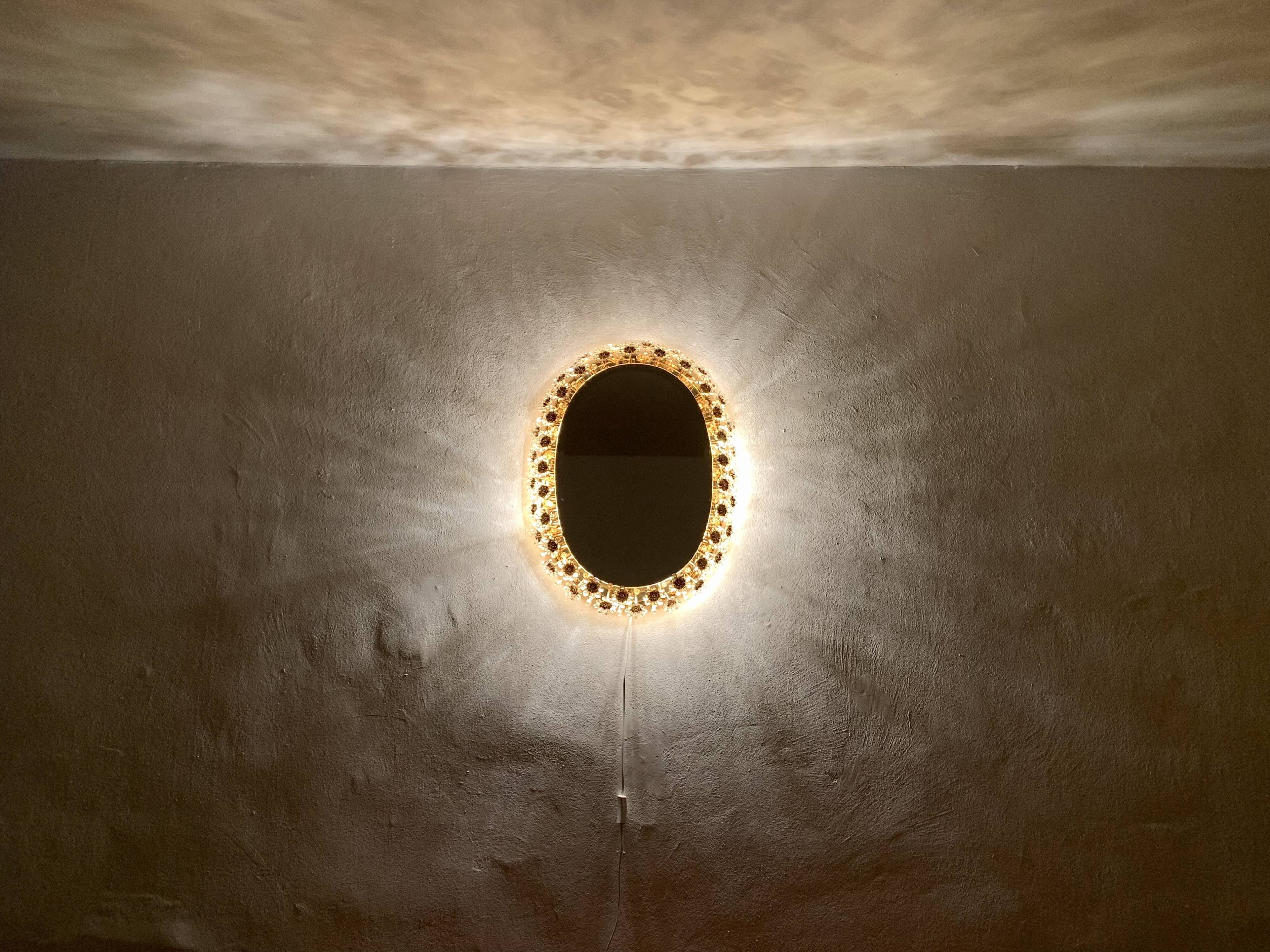 Illuminated floral mirror by Palwa