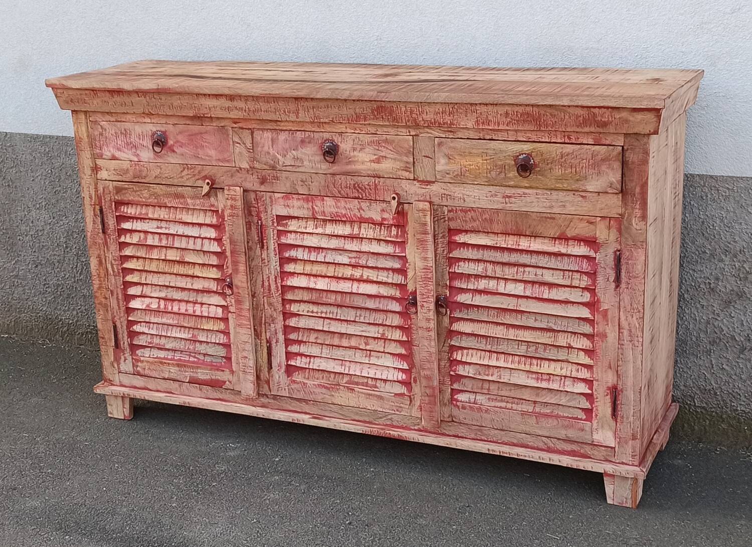 Wooden sideboard with red highlights