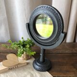 Wooden mirror on foot