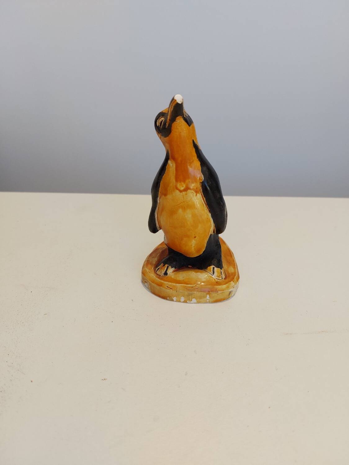 Small plaster penguin statue