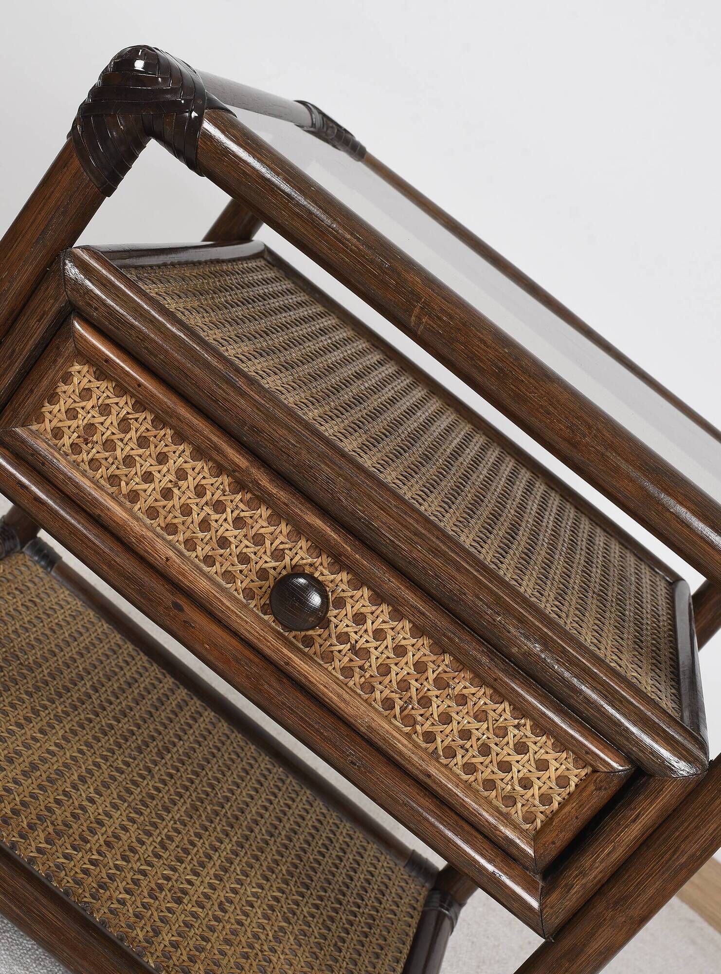 Rattan and cane bedside table, smoked glass top