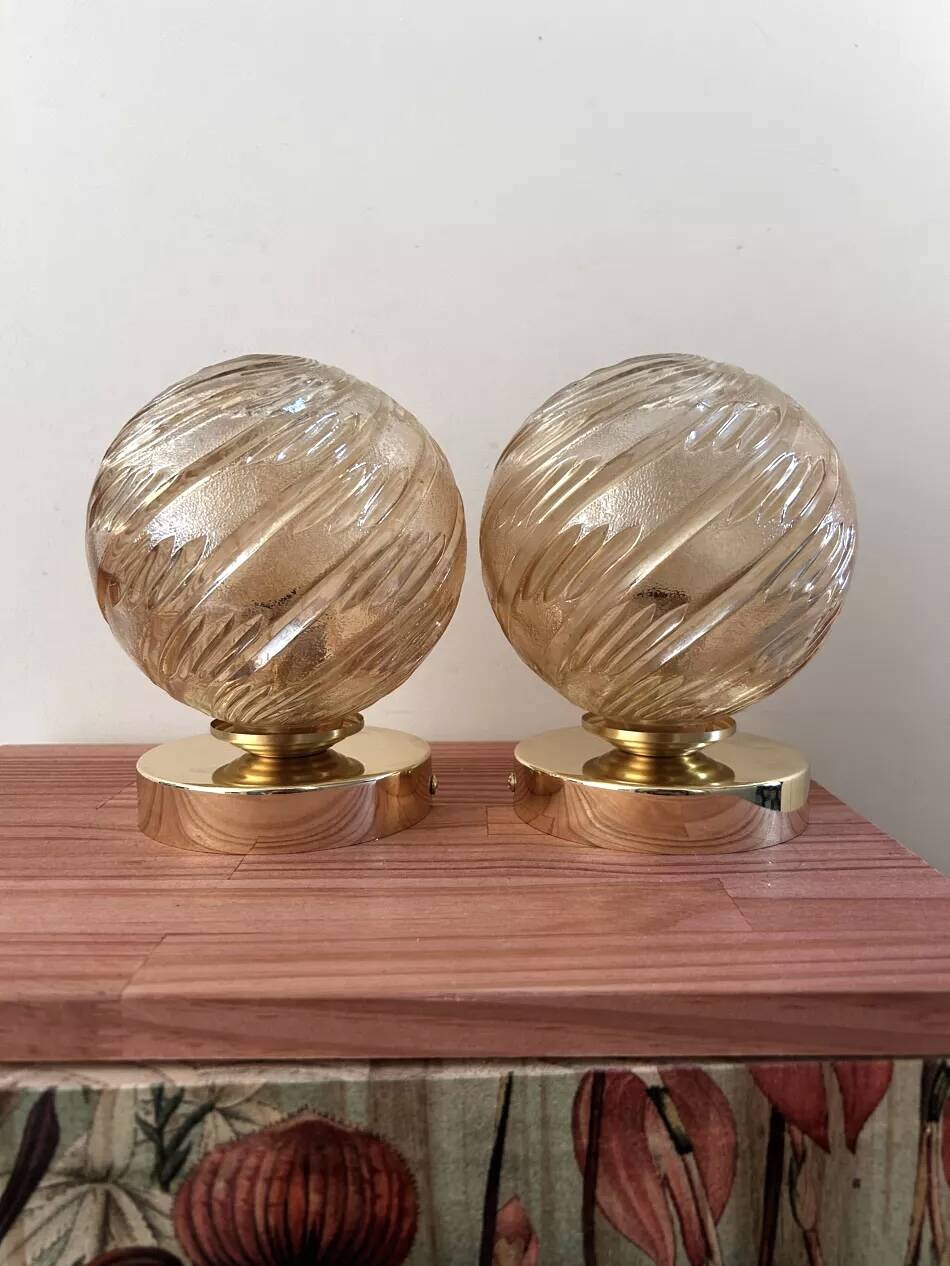 Pair of golden globe wall lights