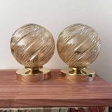 Pair of golden globe wall lights