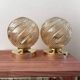 Paire d’appliques globes dorés