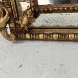 Miroir a parecloses de style Louis XVI en bois et stuc doré XIX siècle