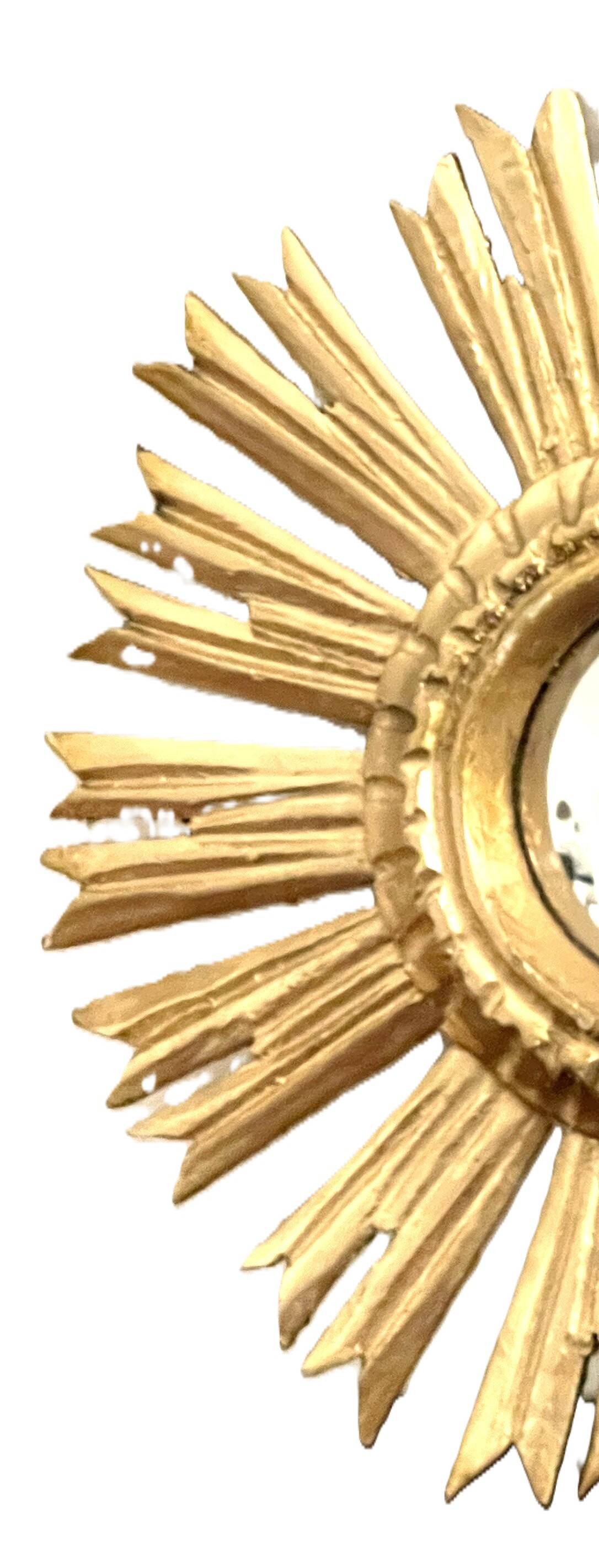 Miroir soleil en bois doré « œil de sorcière »