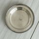 Round patinated silver-plated metal dish