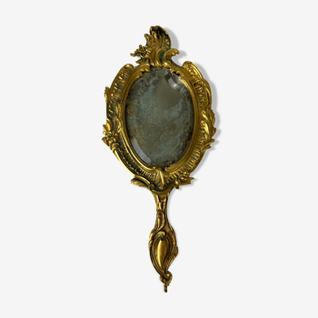 Beveled hand mirror in gilded copper, 13x29 cm