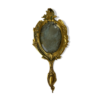 Beveled hand mirror in gilded copper, 13x29 cm