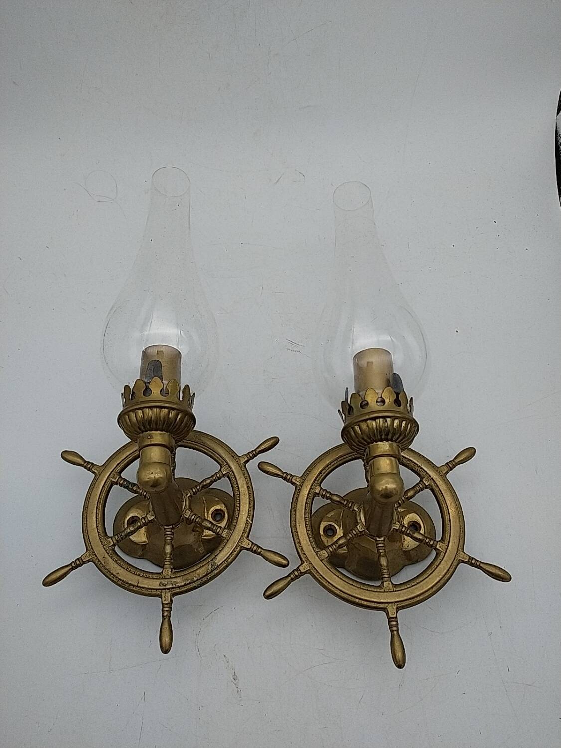 Brass wall sconces with nautical decor