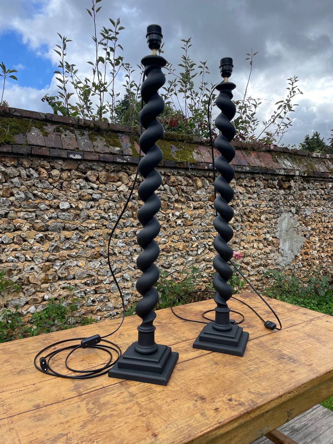 Pair of antique black twisted lamps